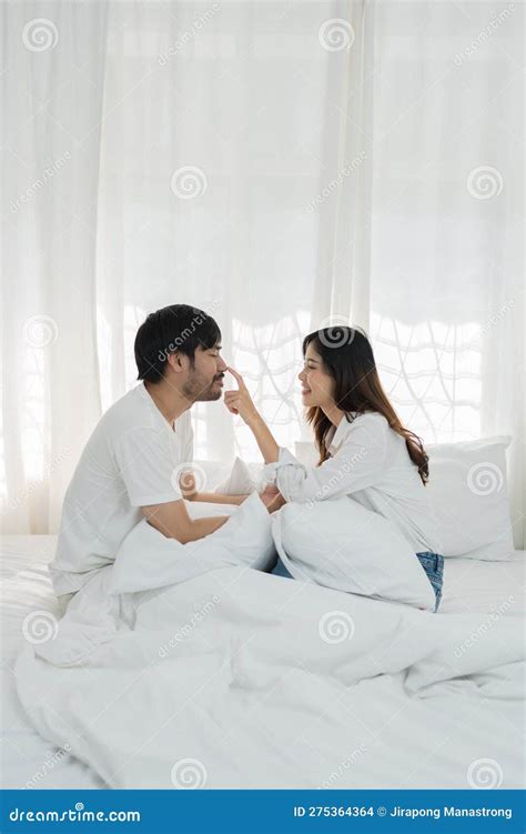 Romantic couple in bed enjoying sensual foreplay. Beautiful